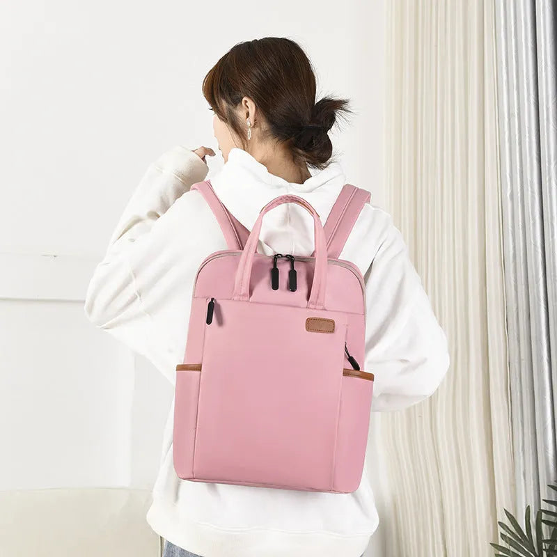 15.6-inch canvas computer backpack in black with waterproof finish and multiple internal compartments