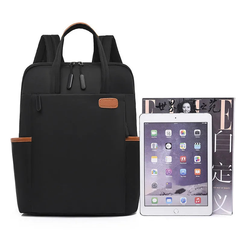 15.6-inch canvas computer backpack in black with waterproof finish and multiple internal compartments