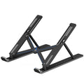 Aluminium alloy folding laptop stand with double triangle support and non-slip pads on a desk