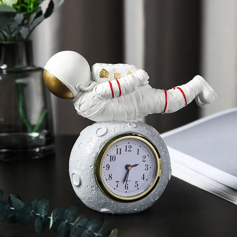 Resin astronaut desktop clock decoration in gold finish for children's bedroom bookcase