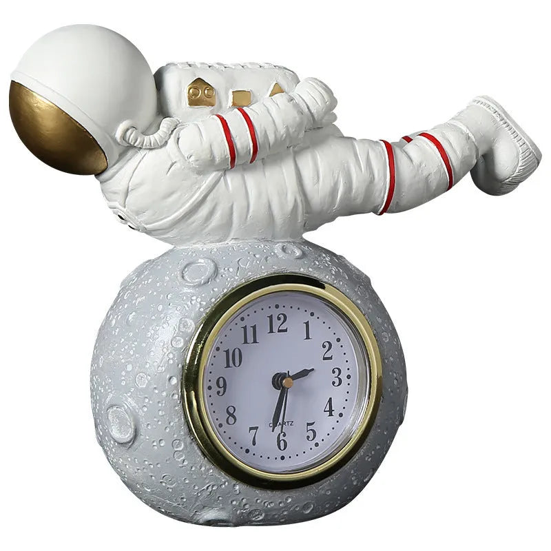 Resin astronaut desktop clock decoration in gold finish for children's bedroom bookcase