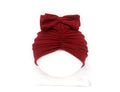 Soft knitted acrylic baby bonnet headwrap for girls in a range of candy colours, fitting 0-28 months.