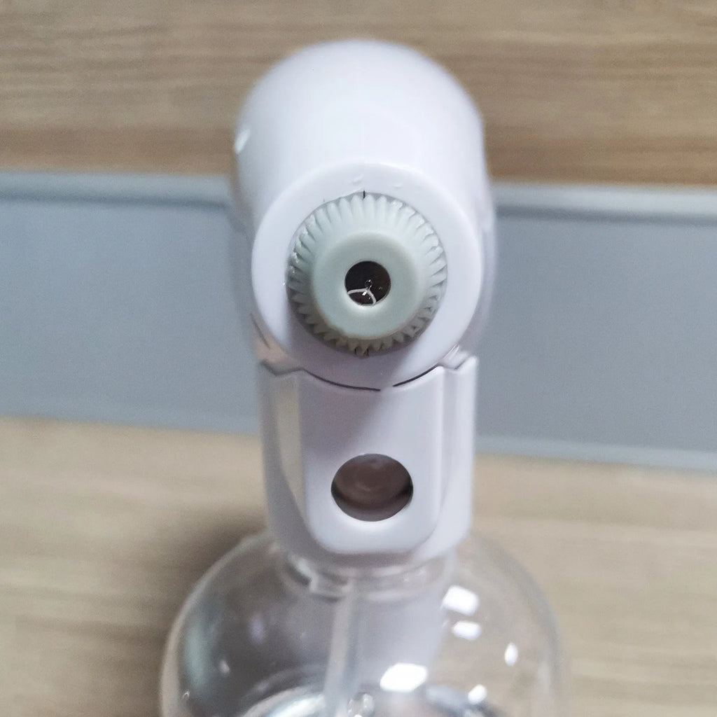 White handheld cordless electric spray disinfection gun with USB charging cable.