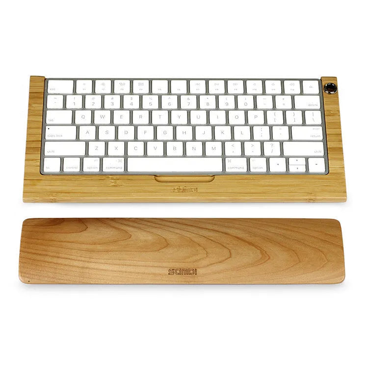 Single-sided wooden keyboard wrist pad in birch wood with machined finish on a desk