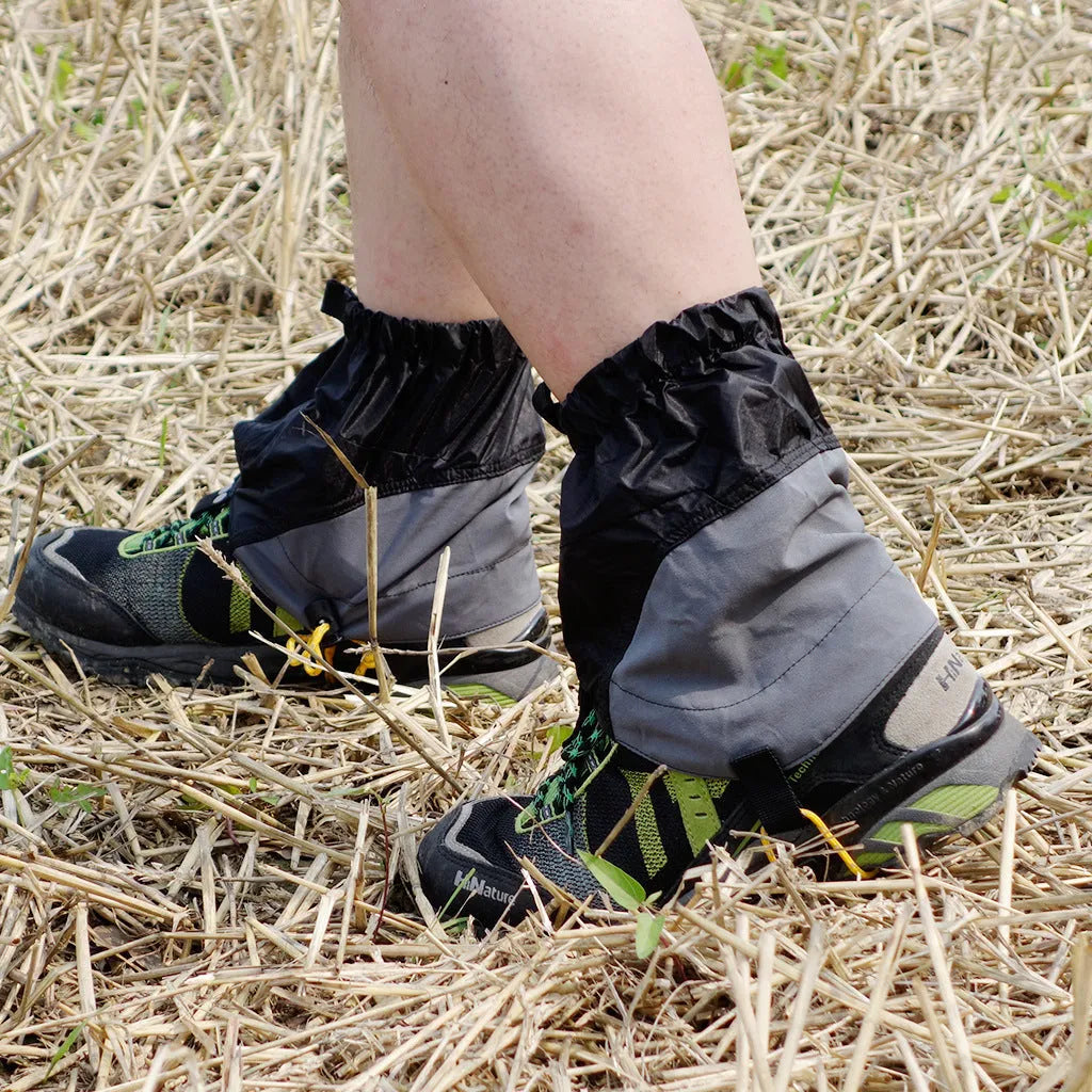 Splash-proof nylon foot cover in black on a rocky trail background, 22cm by 20cm unisex gaiter.