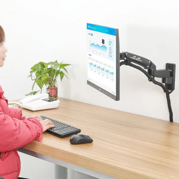 Black wall-mounted computer monitor stand with telescopic lifting arm and rotating VESA bracket