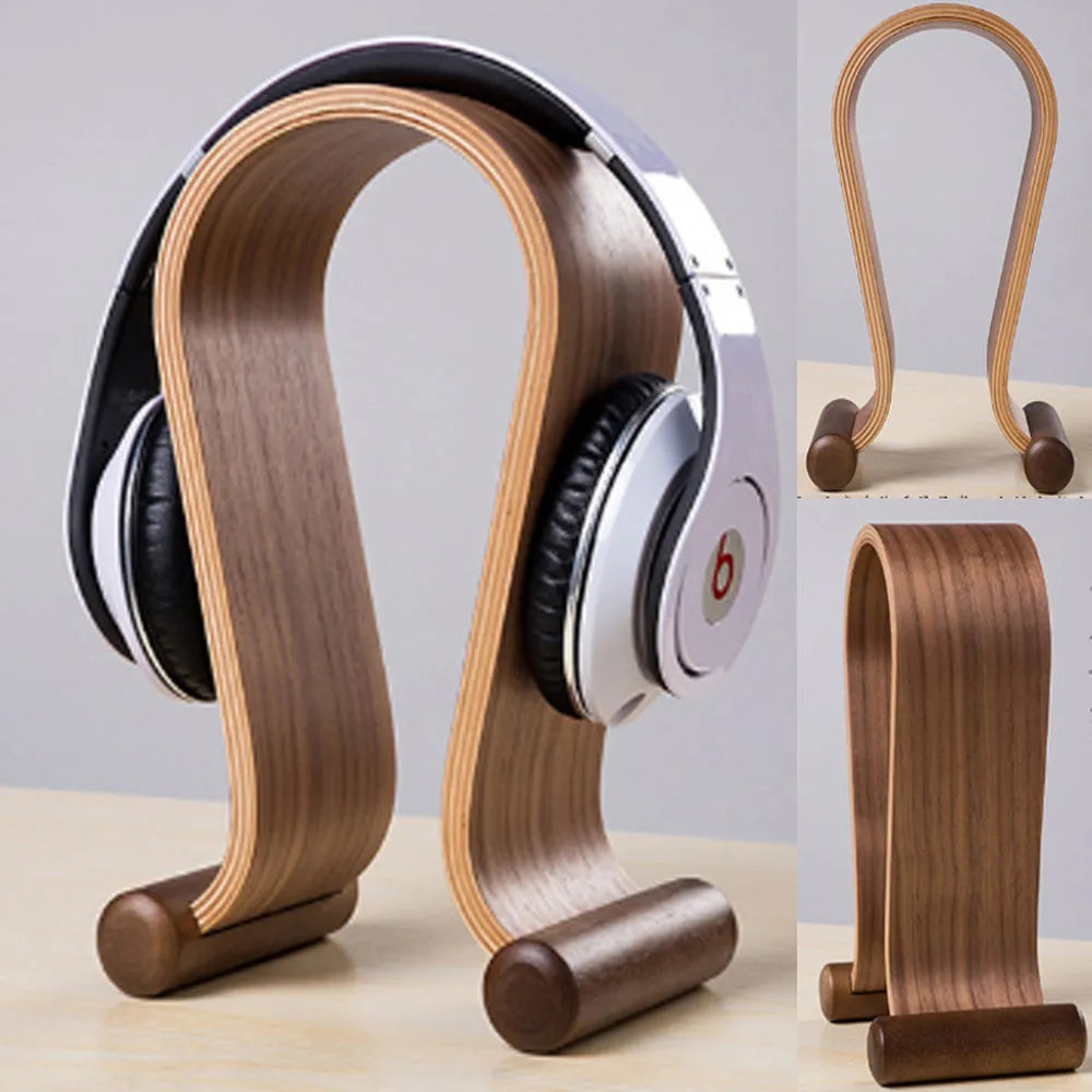 Solid wood earphone display rack in coffee finish on a desk with headphones