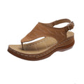 Women's wedge heel sandals with an adjustable buckle strap in a solid colour