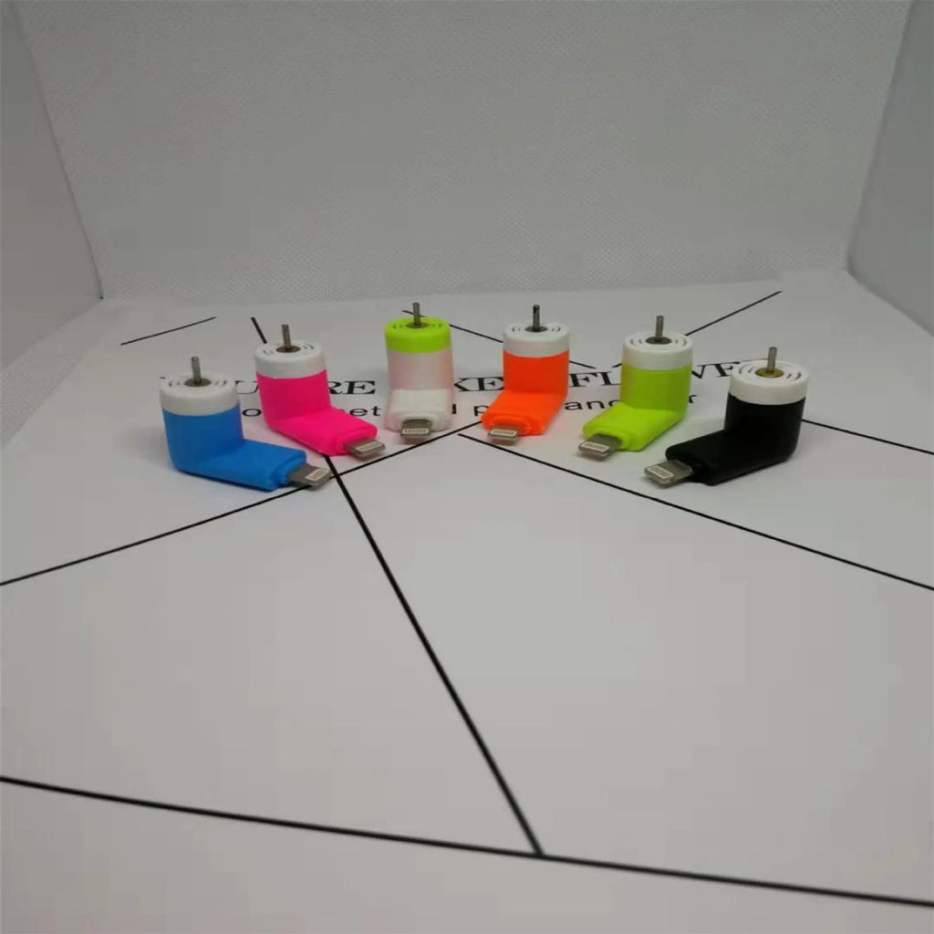 White mobile phone mini fan attached to smartphone showing plastic blades and rotary switch