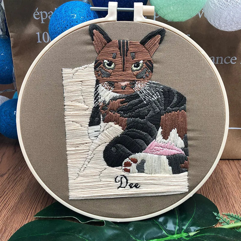 Cross stitch embroidery kit with three-dimensional cat design on cotton fabric with embroidery stretcher