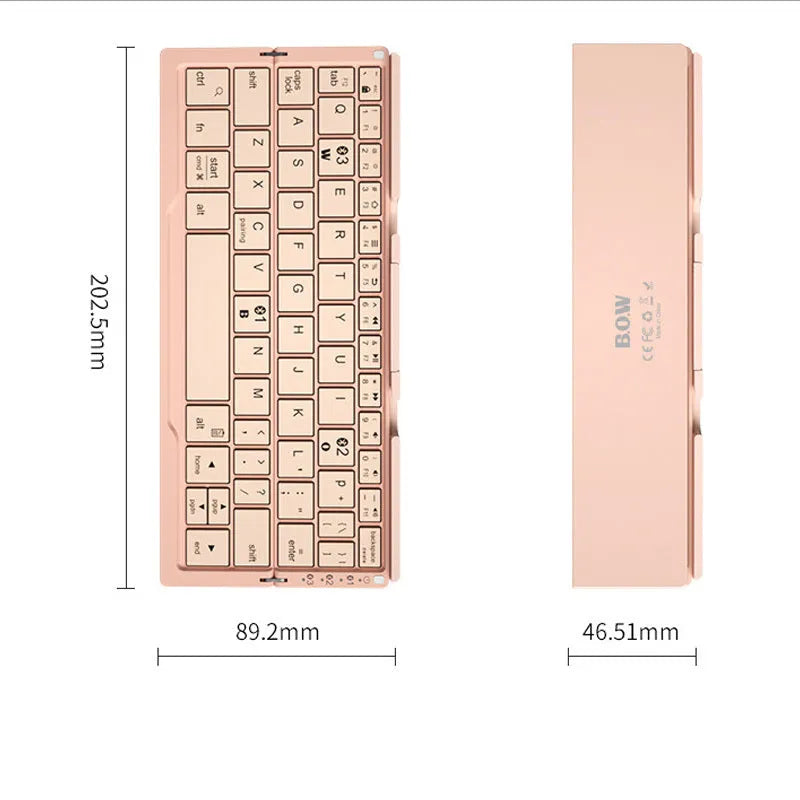 Silver folding Bluetooth keyboard open with phone standing in integrated holder