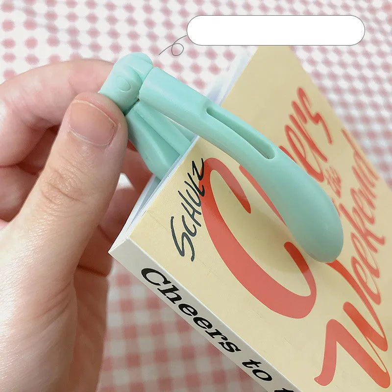 Multifunctional folding book light in blue, showing portable design for reading