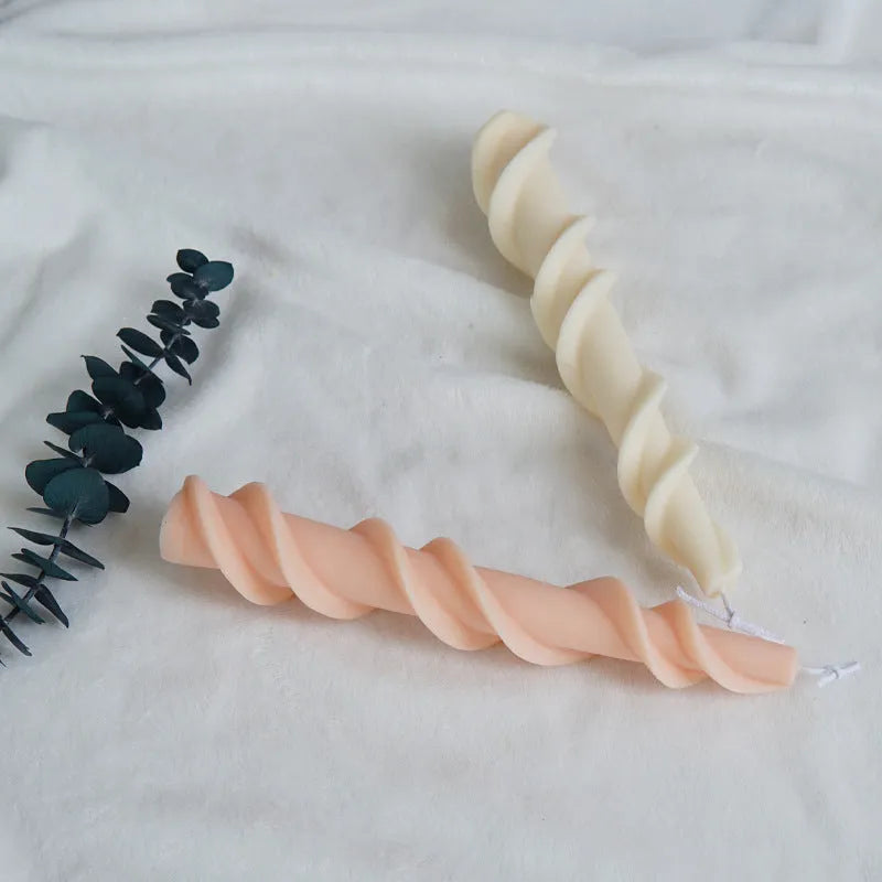 Flexible silicone mould for creating spiral lace rod shaped decorative candles.