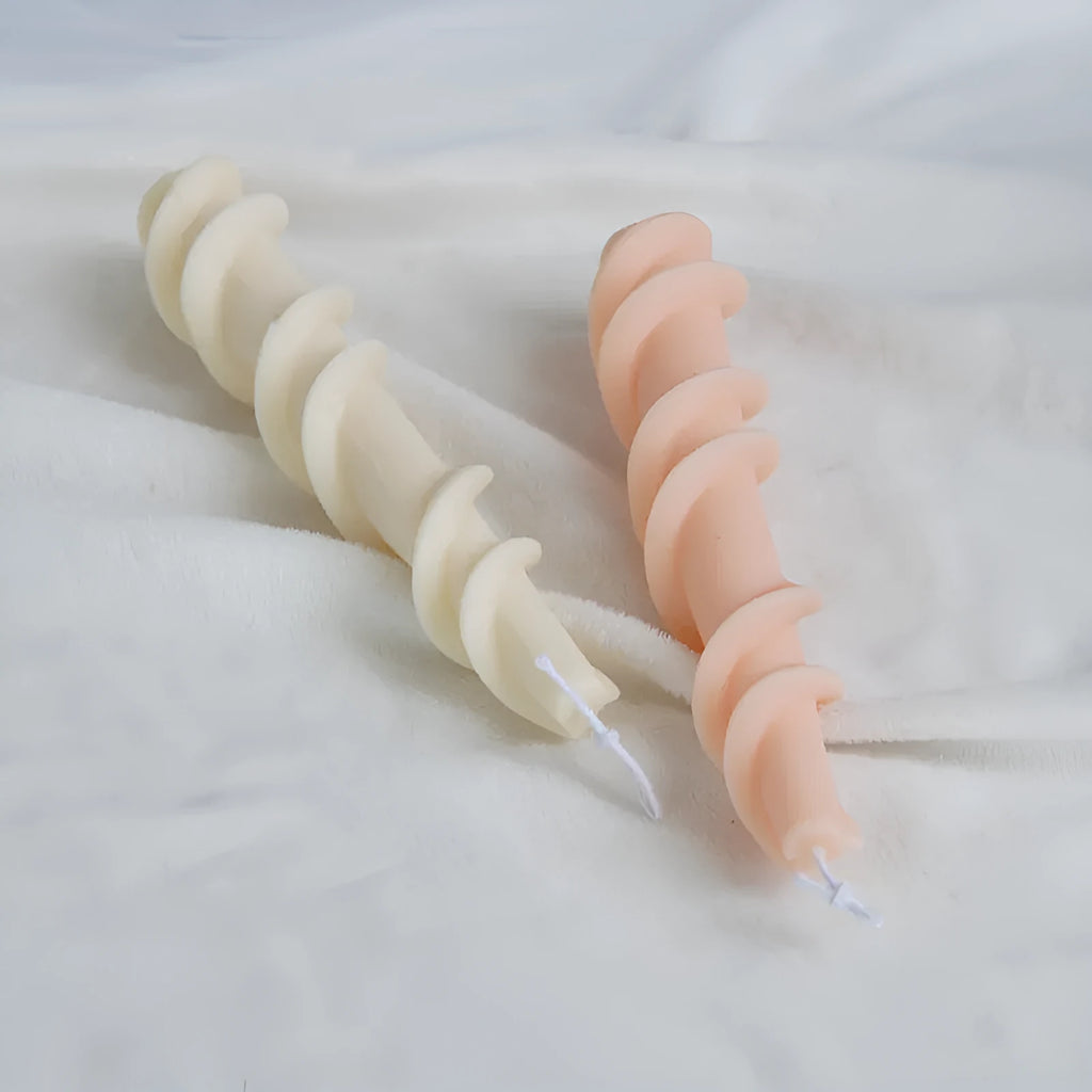 Flexible silicone mould for creating spiral lace rod shaped decorative candles.