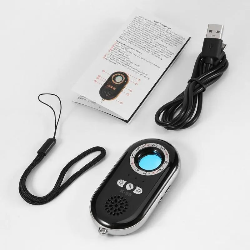 Compact black rectangular wireless signal detector with vibration alarm for security and pinhole camera detection.