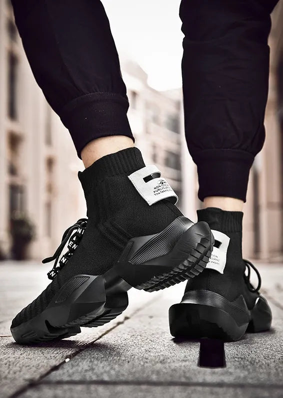 Men's black and white casual sports shoes with mesh lining available in sizes 39 to 47