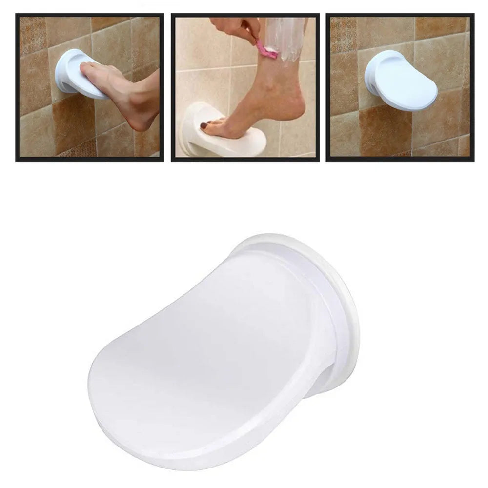 White plastic shower foot rest with suction cups, used as a step for washing feet or shaving legs in the bath or shower.