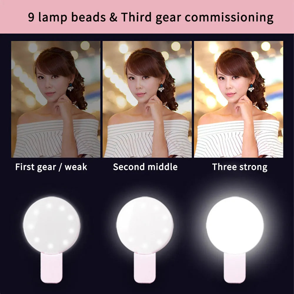 Round white clip-on mini fill light attached to a mobile phone for selfies