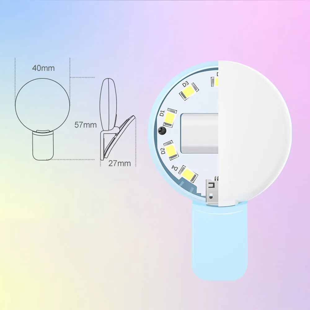 Round white clip-on mini fill light attached to a mobile phone for selfies