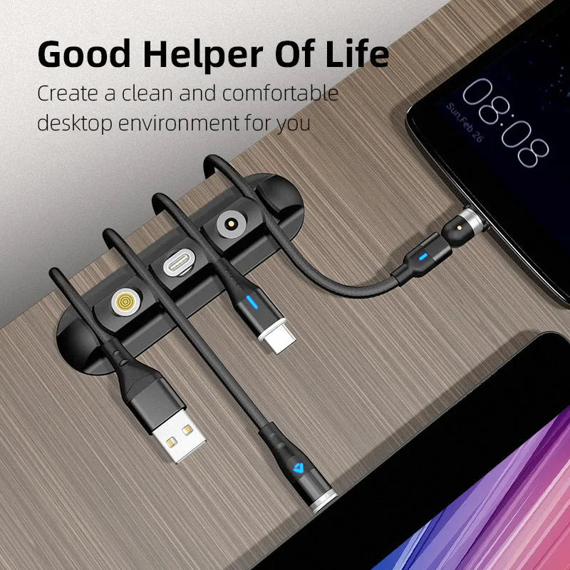 Black soft plastic desktop magnetic charging cable organiser on desk