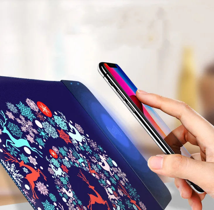 Colourful cartoon wireless charging mouse pad with RGB lighting, showing non-slip rubber base and cloth surface.