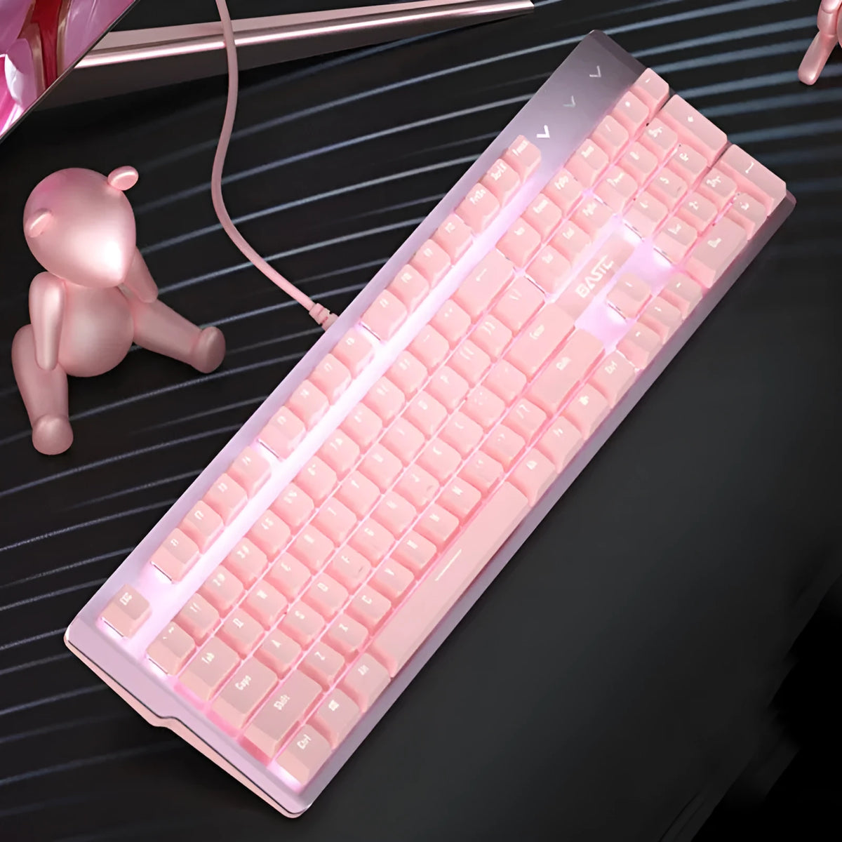 Pink mechanical gaming keyboard and wired mouse set on desk with USB cables