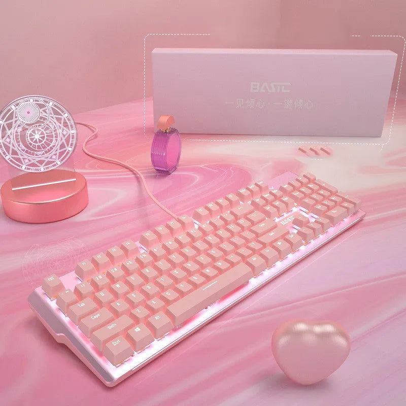 Pink mechanical gaming keyboard and wired mouse set on desk with USB cables