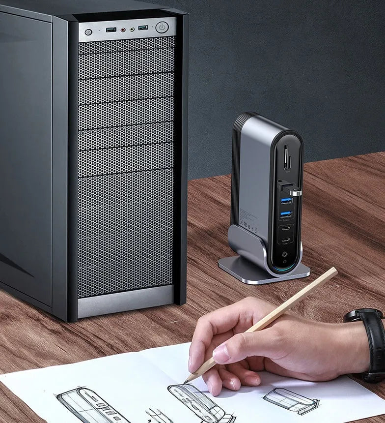 Deep space grey 16-in-1 USB-C docking station with external power supply on desktop