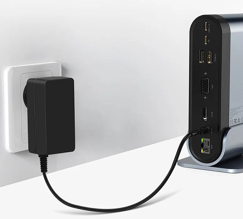 Deep space grey 16-in-1 USB-C docking station with external power supply on desktop