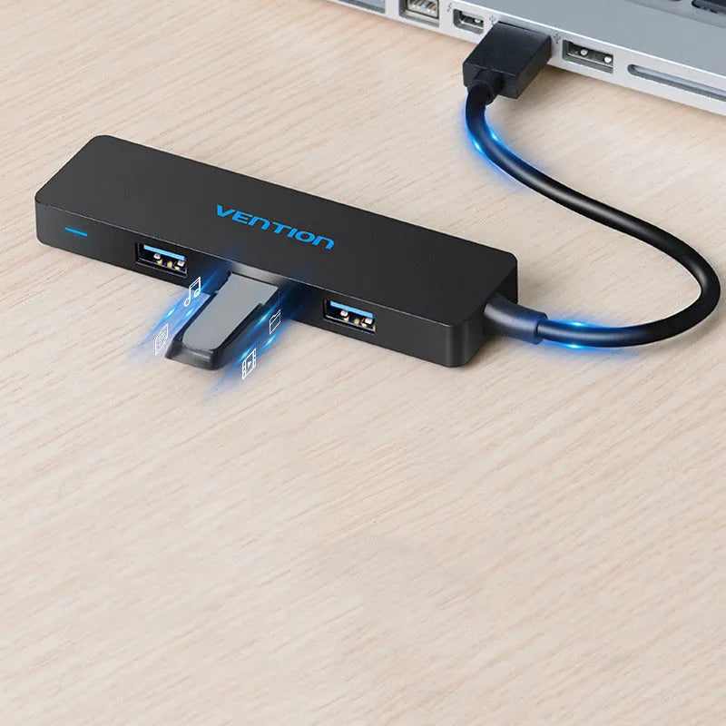 Black four-port USB 3.0 hub with a short cable and nickel-plated connectors