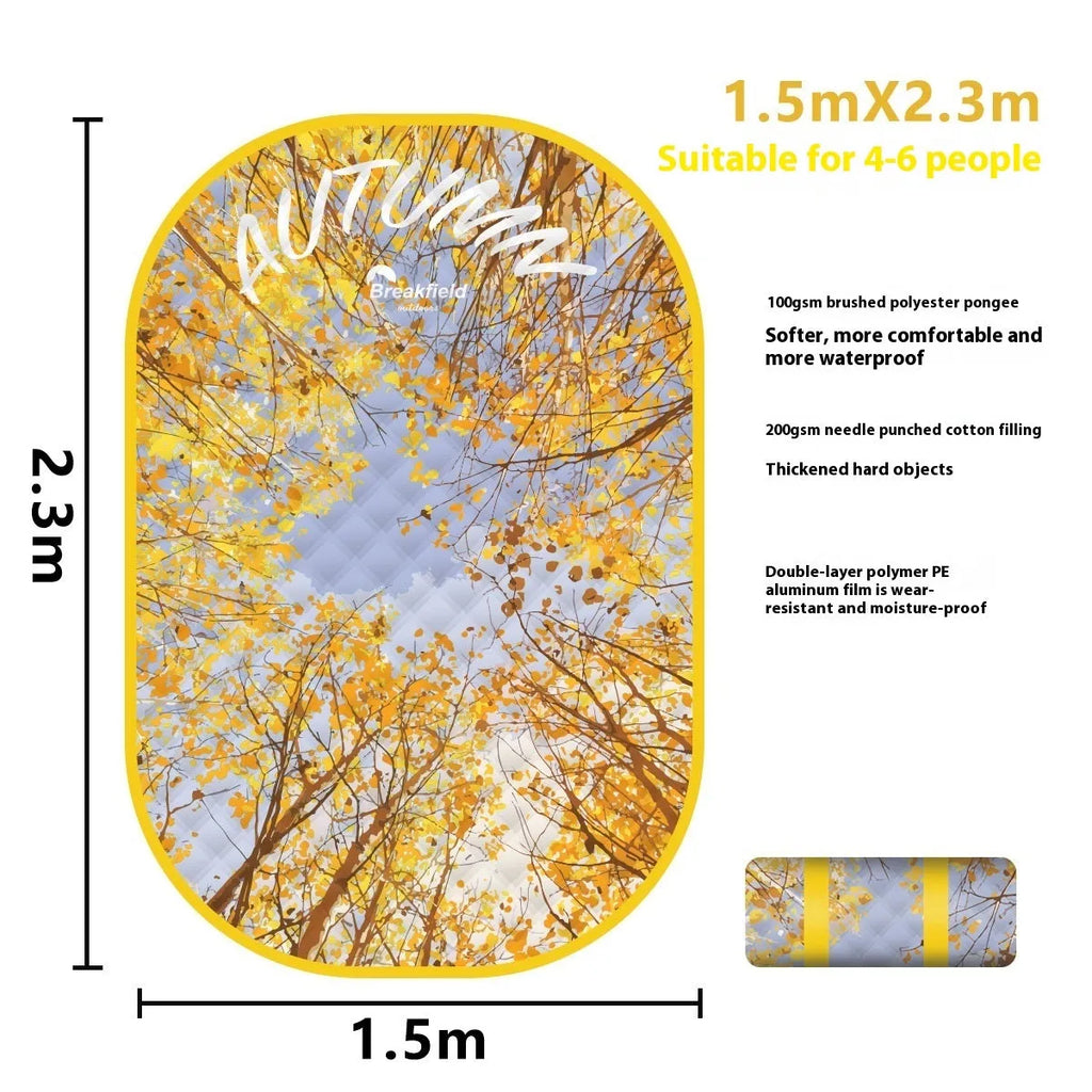 Waterproof thickened picnic mat in a seasonal colour, laid out flat on grass.