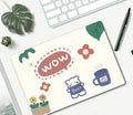 Wind-shaped cartoon design mouse pad on a desk, showing rubber base and 260x210mm size.
