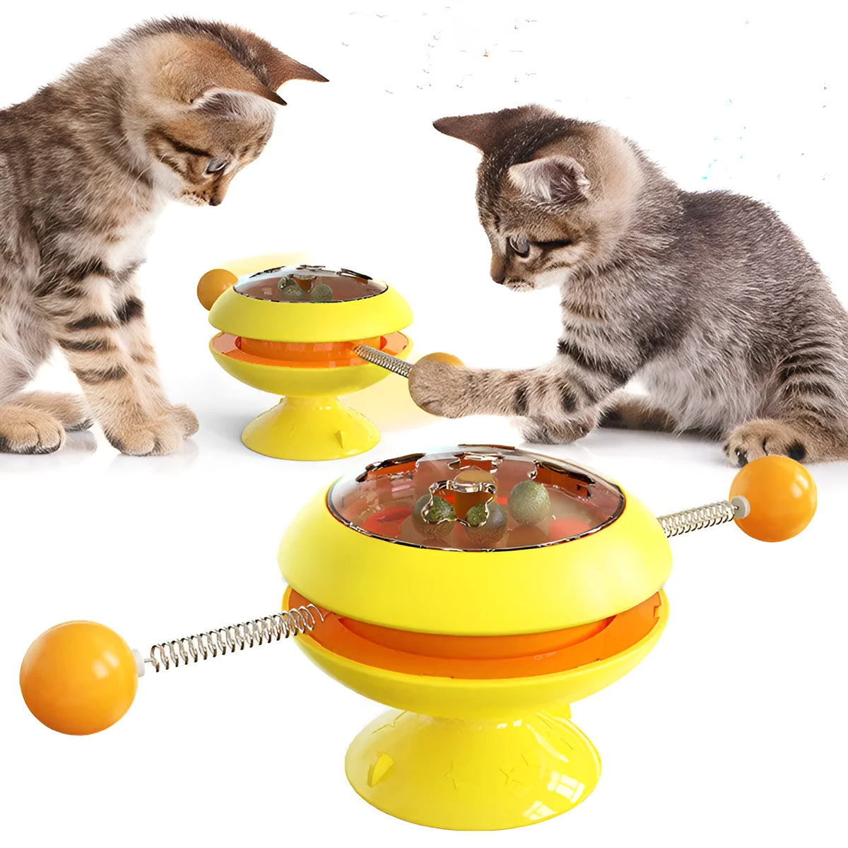 Rotating turntable cat toy with transparent section showing catnip balls and large suction cup base