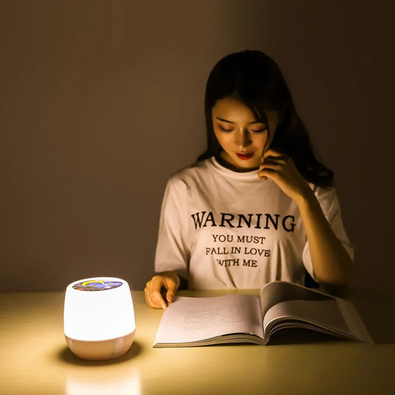 Pruixin PRX1363 remote control LED projector night light projecting star patterns on a ceiling.