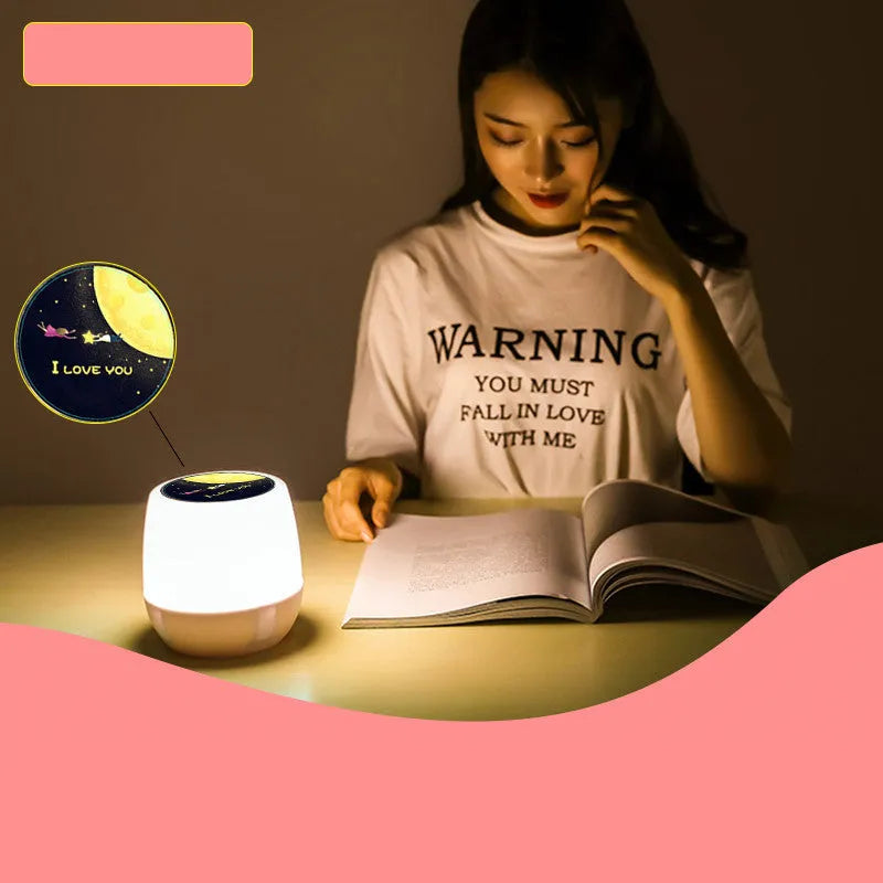 Pruixin PRX1363 remote control LED projector night light projecting star patterns on a ceiling.