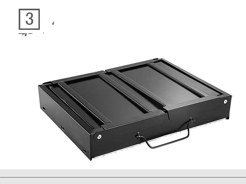 Folding portable charcoal barbecue grill on outdoor table showing 35x27x20cm cooking area