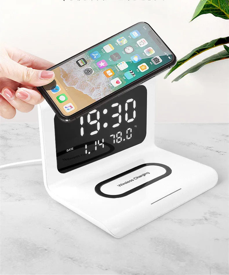 White wireless charger alarm clock showing time, date, and temperature on digital display