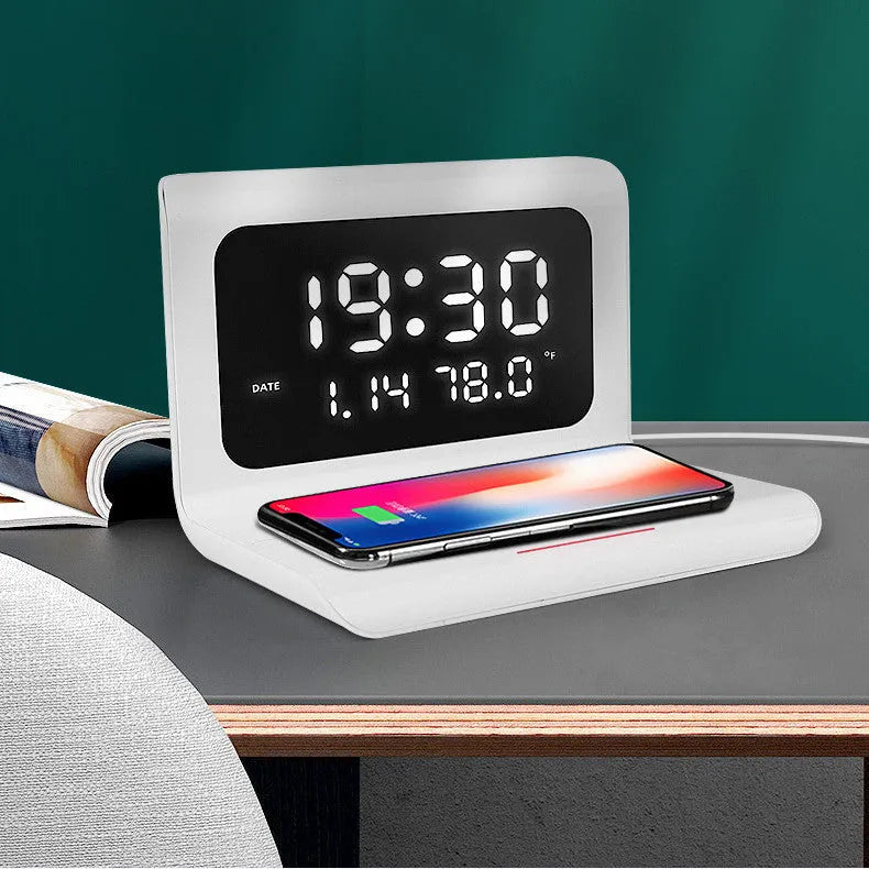 White wireless charger alarm clock showing time, date, and temperature on digital display