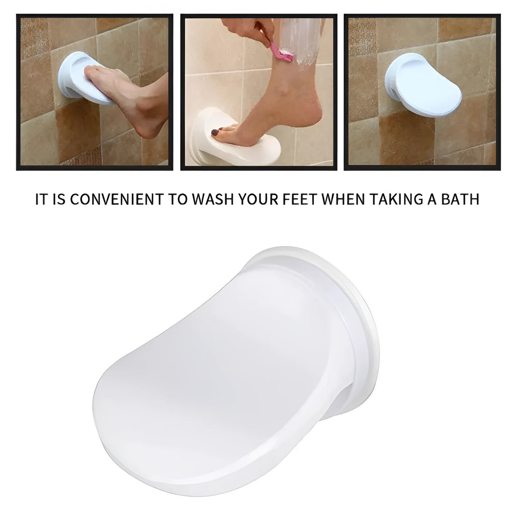White plastic shower foot rest with suction cups, used as a step for washing feet or shaving legs in the bath or shower.