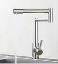 Silver stainless steel kitchen tap with rotating spout showing 360-degree movement capability