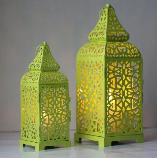Blue geometric metal Moroccan hanging candlestick with hollow design for candle display.