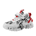 Boys' blue and beige Velcro sneakers with a rubber sole on a white background