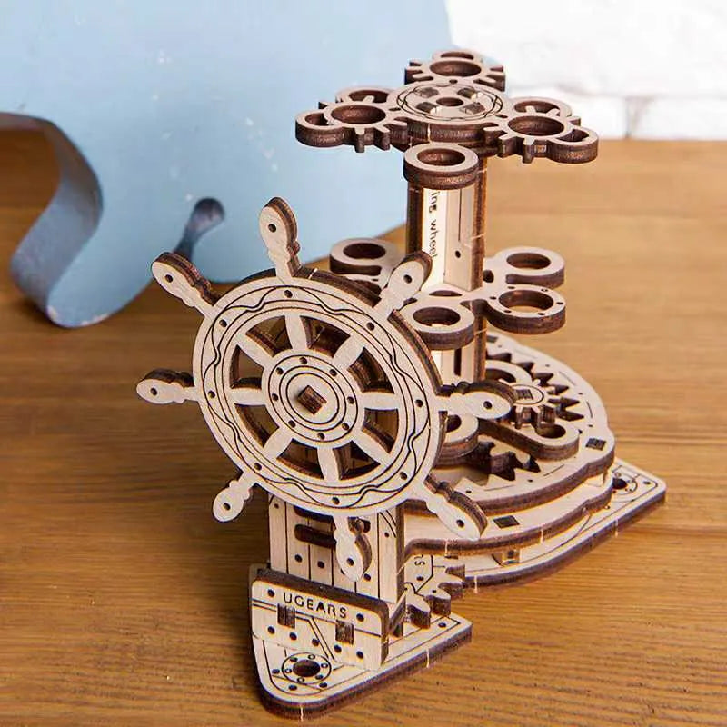 Ukrainian wooden rotating pen holder with steering wheel mechanism on desk
