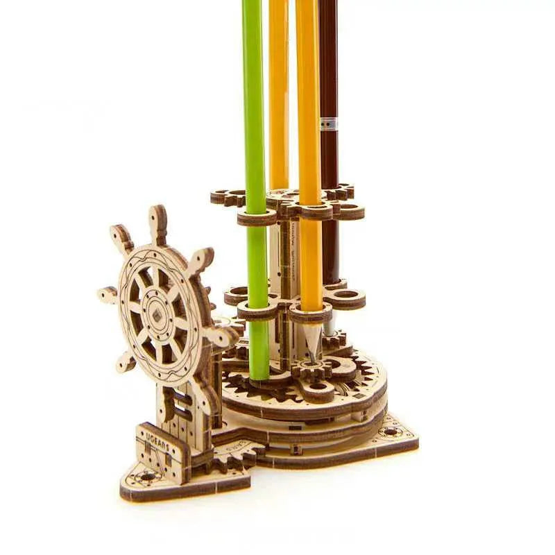 Ukrainian wooden rotating pen holder with steering wheel mechanism on desk