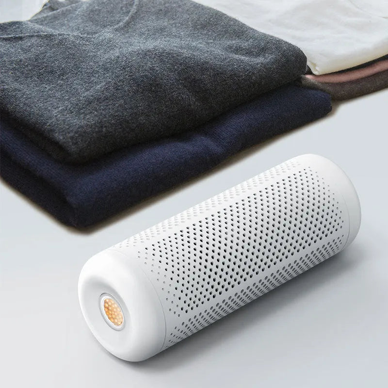 White mini dehumidifier for small rooms up to 10 square metres with a 1-litre water tank.