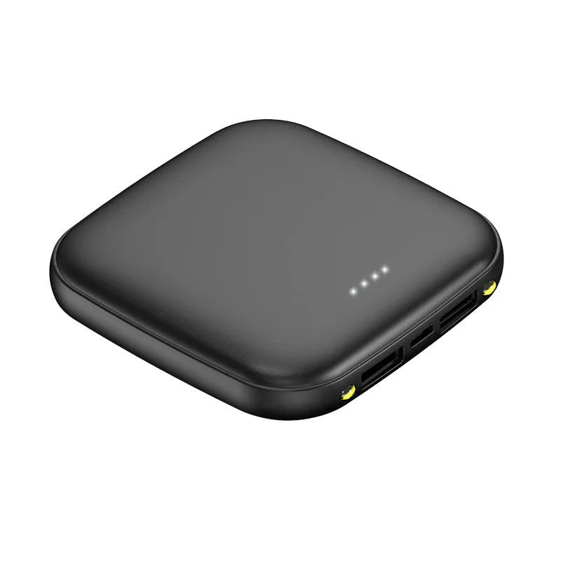Compact black mini power bank with 20000mAh capacity and LED flashlight on a table.