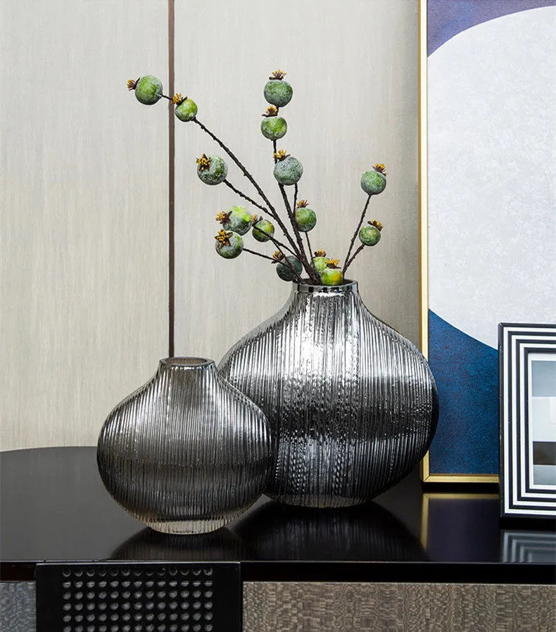 Silver brushed electroplated glass vase L size 25x13x25cm with striped finish on table