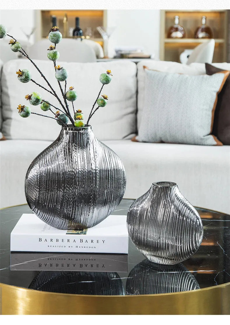 Silver brushed electroplated glass vase L size 25x13x25cm with striped finish on table