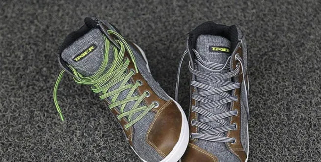 Black and grey men's casual motorcycle short boots with breathable panels and a non-slip sole.