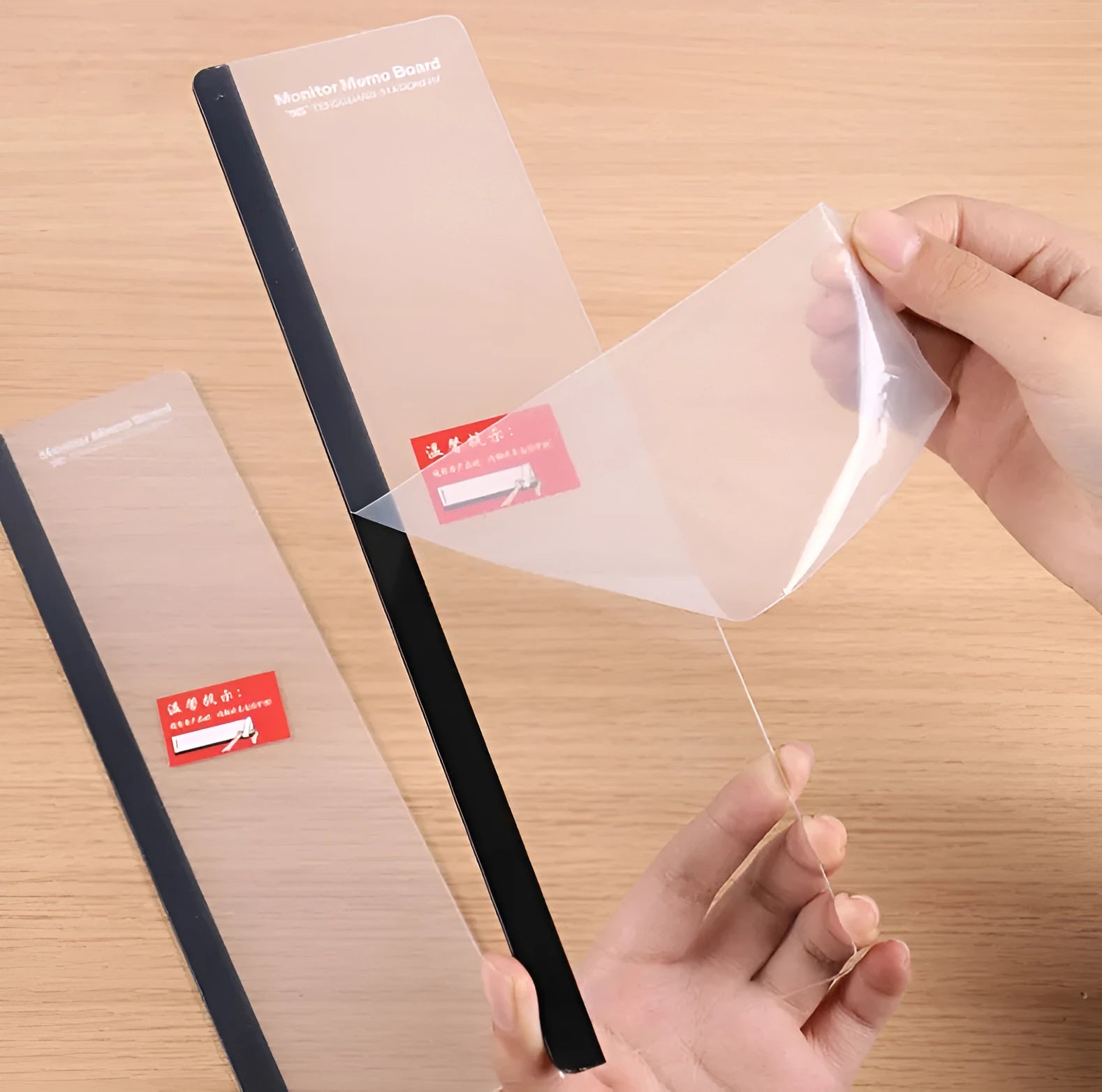 Transparent acrylic computer monitor side pane 28 x 7.8 cm holding a note on the side of a monitor